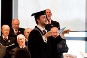 Daniel conducts the audience singing. August 2018